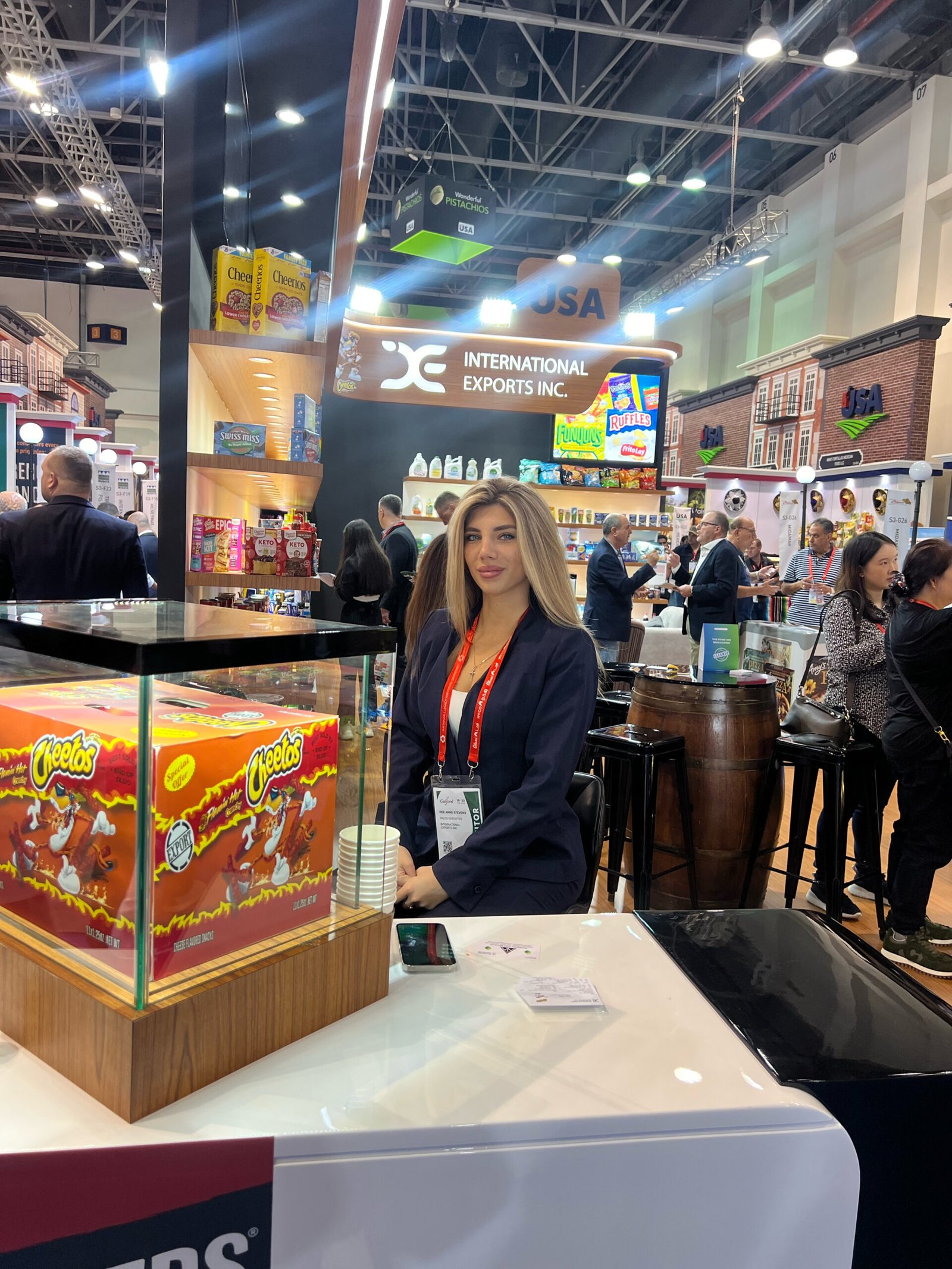 Professional at an international exports booth featuring popular brands