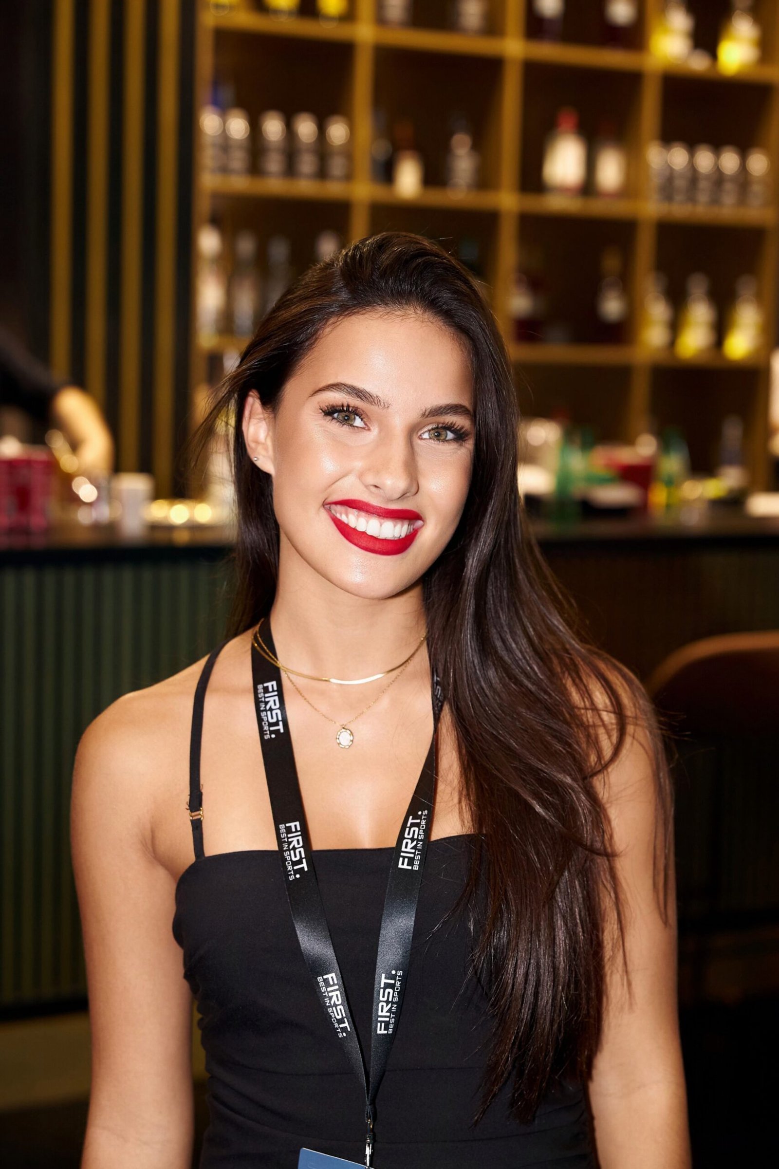 Elegant woman with a radiant smile attending a luxury event