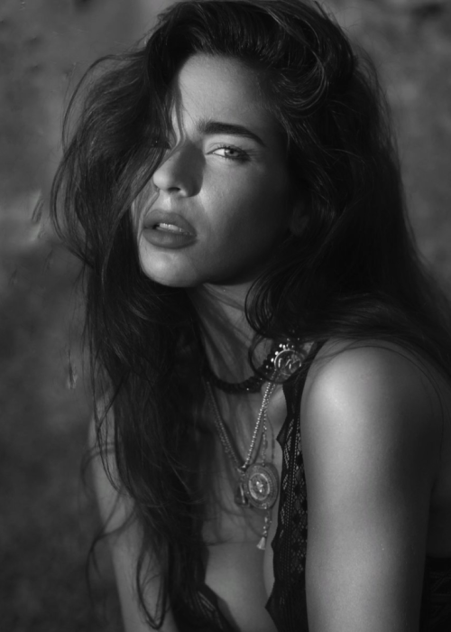 Sophisticated black-and-white artistic portrayal of the model.